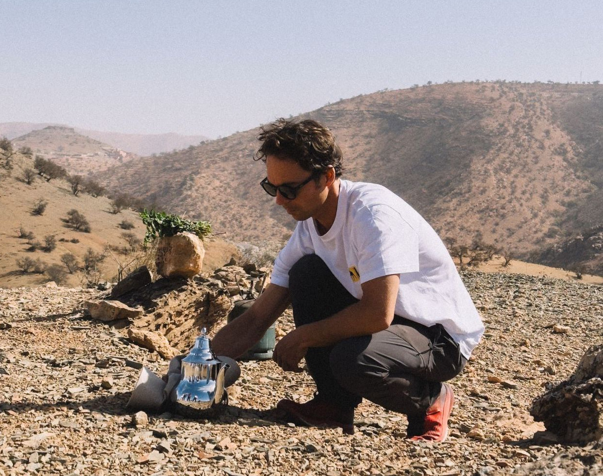 Tim, the founder of Bookinglayer, making mint tea in the desert.